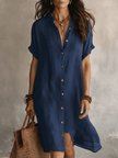 FJØRNA black linen midi dress with a relaxed boho style, featuring a flowing silhouette and effortless design.
