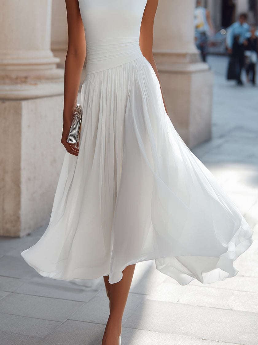 FJØRNA draped neck sleeveless pleated midi dress displayed on a hanger, showcasing its elegant design and flowy fabric.