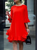 FJØRNA falbala solid color round-neck midi dress with ruffled details, displayed on a mannequin in a bright setting.