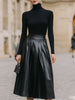 FJØRNA black turtleneck and leather pleated skirt set for women, stylish dress with sleek black leather fabric and fitted design.