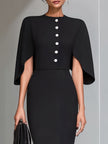 FJØRNA black cape-sleeve midi sheath dress displayed on a hanger, showcasing its sleek design and elegant silhouette.
