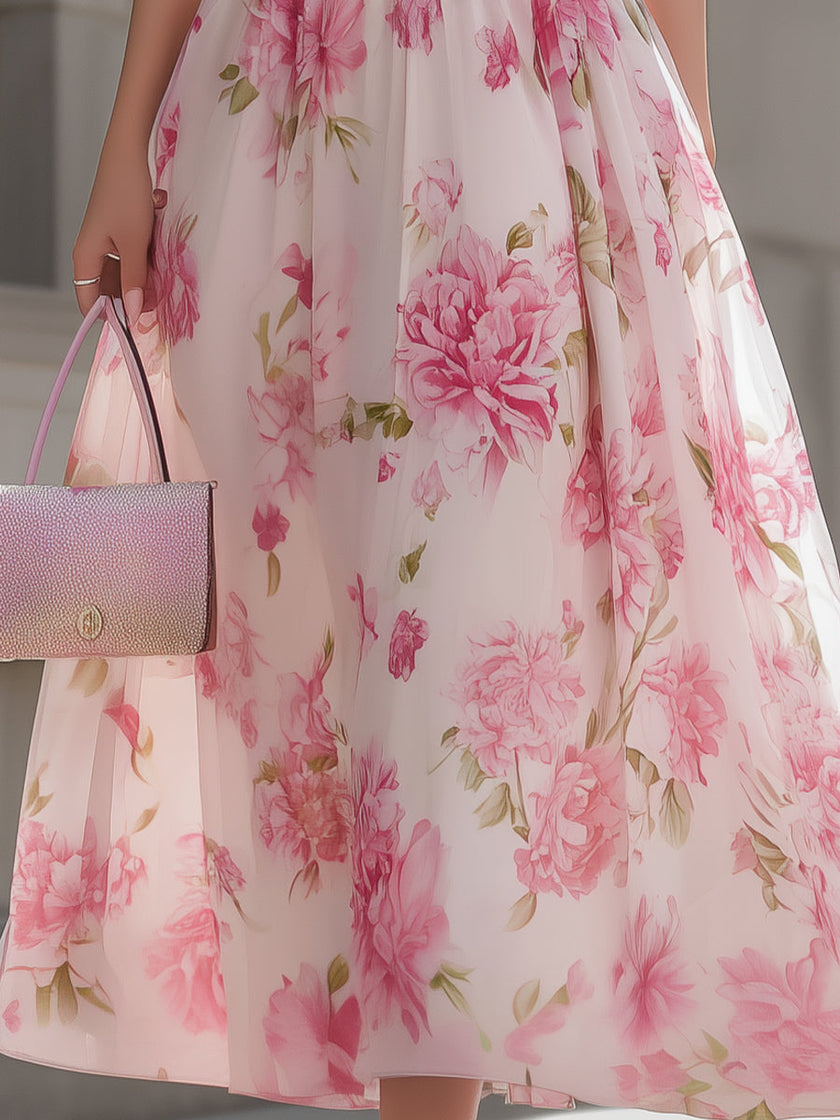 Pink floral one-shoulder chiffon midi dress from FJØRNA, featuring a flowing design and elegant floral pattern.