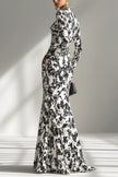 Black and white color-blocked printed long-sleeve maxi dress by FJØRNA featuring a slim fit, pleated skirt, and front pocket details.