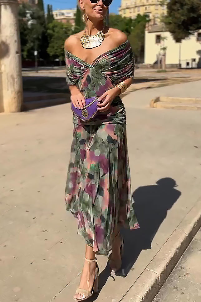 White FJØRNA V-neck maxi dress with fantasy floral print, elegant design, perfect for parties and special occasions.