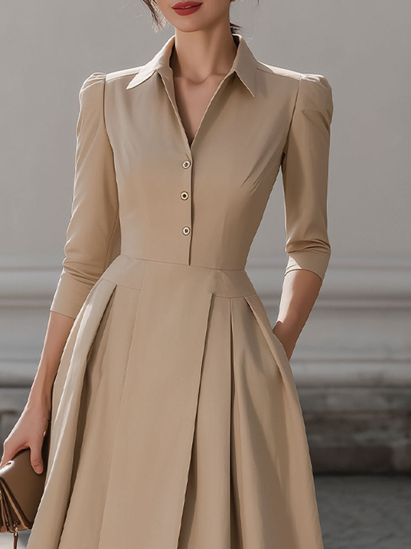Beige FJØRNA pleated midi dress with shirt collar for women, featuring a flowy silhouette and stylish design.