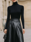 FJØRNA black turtleneck and leather pleated skirt set for women, stylish dress with sleek black leather and fitted turtleneck.