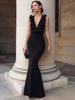 FJØRNA Eep V Ruffle Trim Mermaid evening gown with long sleeves, elegant maxi dress featuring ruffle details and a fitted silhouette.
