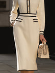 FJØRNA classic contrast-trim midi dress with button details, showcasing a stylish and elegant dress with a fitted silhouette.