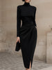 FJØRNA black turtleneck midi dress with a draped design, form-fitting silhouette, and long sleeves, showcased on a model.