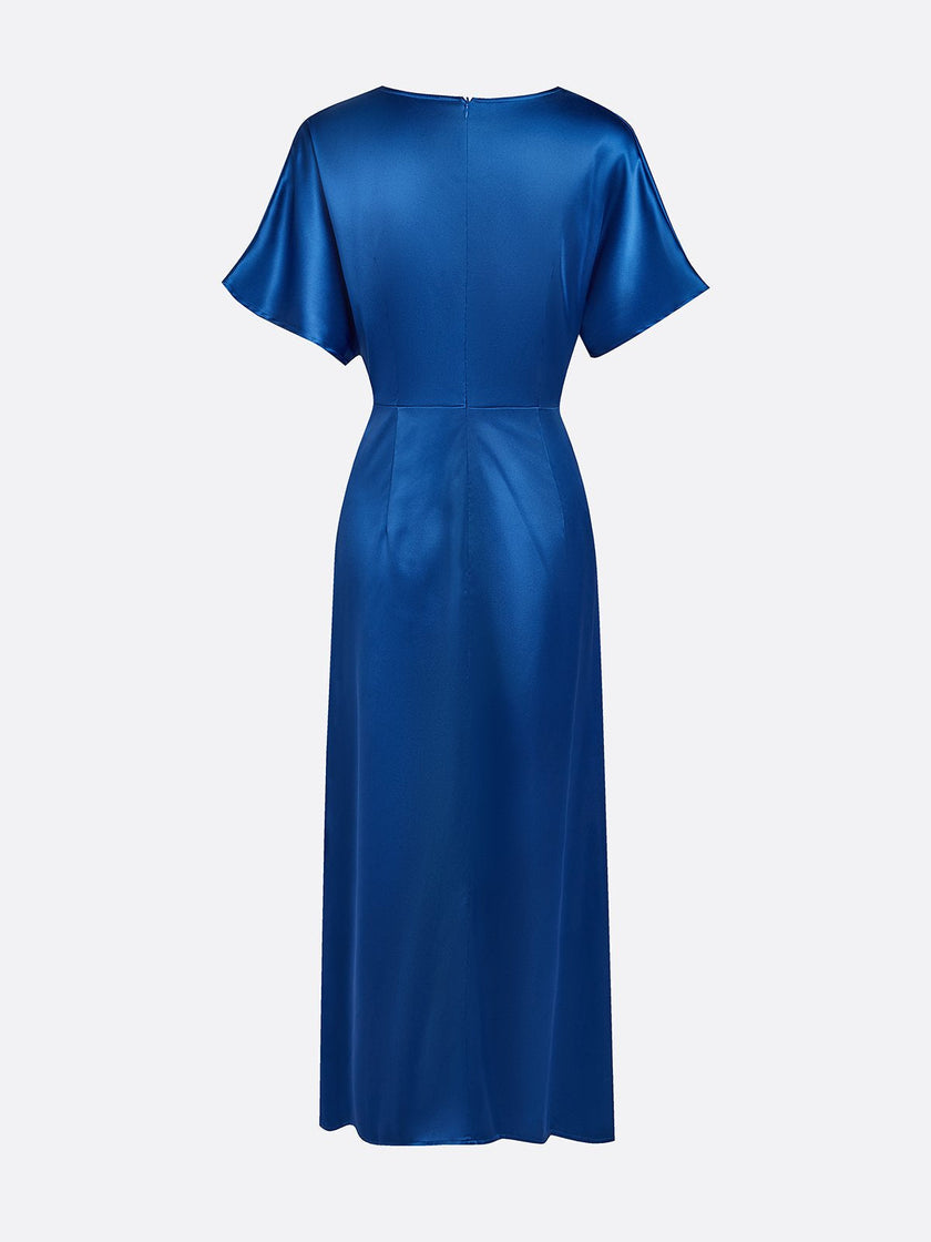 FJØRNA draped maxi dress with ruched V-neck and raglan sleeves, flowing silhouette, and elegant fabric for a stylish look.