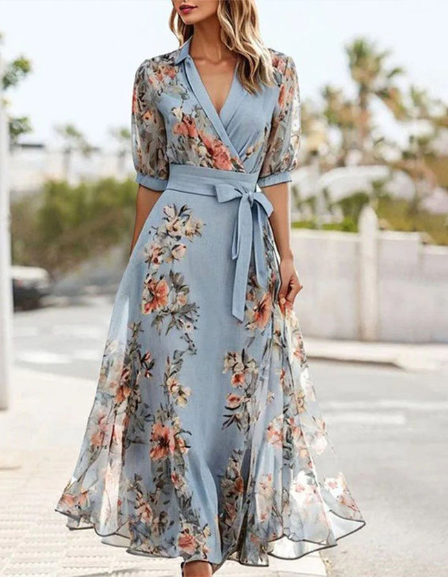 Blue FJØRNA midi dress for women with lapel collar and printed design, showcasing a stylish and elegant dress silhouette.