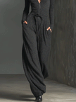 Sparkling knit jumpsuit for women with zip front, long sleeves, wide-leg pants, by FJØRNA, shown in a close-up view.