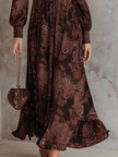 FJØRNA Eloise paisley zip-waist maxi dress in white, flowing fabric with a fitted waist and long sleeves, elegant and stylish.