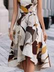 FJØRNA abstract floral sleeveless fit and flare midi dress with a vibrant floral pattern and elegant silhouette.