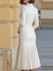 FJØRNA high-neck belted long-sleeve pleated midi dress for women, featuring a stylish design and flowing pleated fabric.