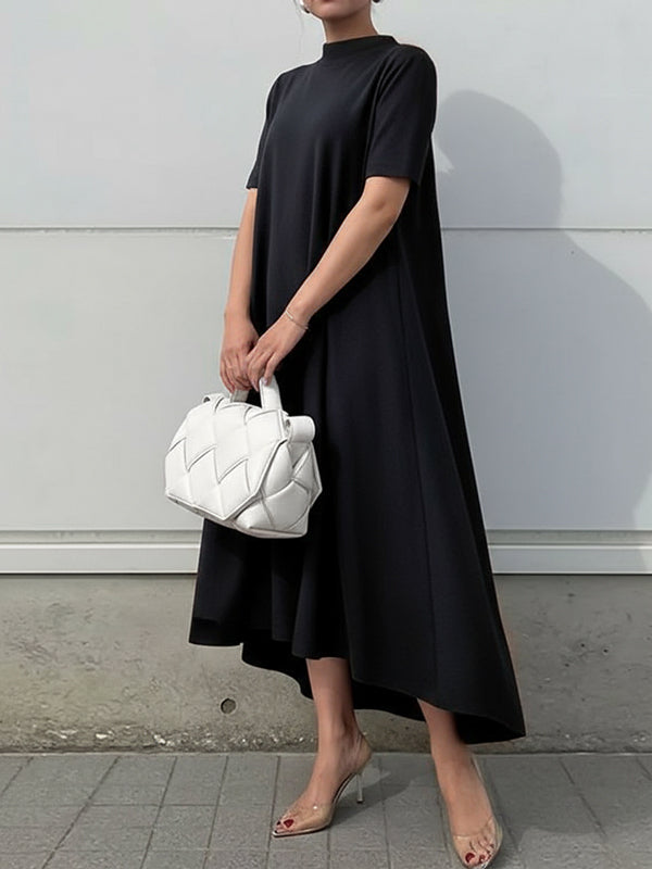 FJØRNA white high-low maxi dress with short sleeves and solid color, flowing fabric and elegant silhouette.