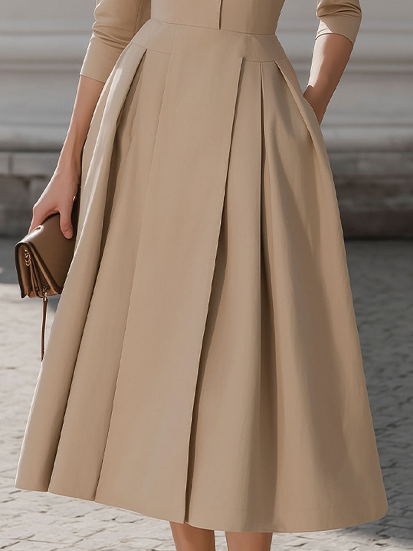 Beige FJØRNA pleated midi dress with shirt collar, sleeveless design, and button front, perfect for elegant daytime wear.