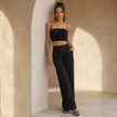 FJØRNA women's summer co-ord set with crop top and wide-leg pants, light and stylish outfit for warm weather.