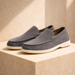 FJØRNA men's suede slip-on loafers displayed on a plain background, showcasing their sleek design and classic style.