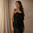 FJØRNA sequin top for women, stylish and shiny, featuring a fitted design with shimmering sequins, perfect for evening wear