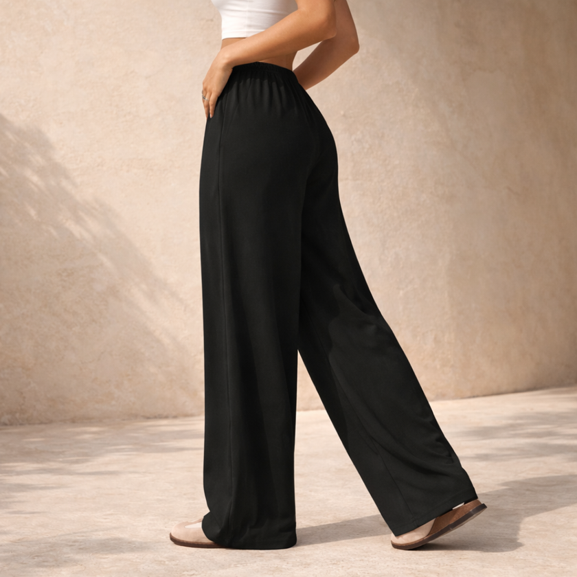 FJØRNA women's lounge trousers with drawstring waist, relaxed fit, soft fabric, perfect for comfortable casual wear.