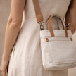 Large canvas messenger bag for women by FJØRNA, featuring a spacious design and adjustable strap for versatile everyday use.