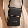 FJØRNA women's anti-theft travel crossbody bag with adjustable strap, featuring secure compartments and stylish design.