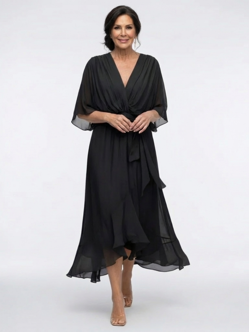 Flowy FJØRNA summer midi dress for women with wrap design and sleeveless style, perfect for warm-weather occasions.