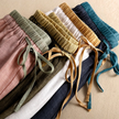 FJØRNA women’s linen tapered trousers, light and breathable pants with a relaxed fit and natural fabric texture.