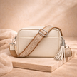 FJØRNA genuine leather chevron strap crossbody bag for women with stylish design and functional size.