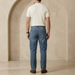 FJØRNA men's elastic waist jeans showing a classic denim style with a comfortable fit and modern design.