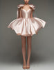Light pink satin cocktail dress for women with sweetheart neckline, corset style, and bow detail by FJØRNA