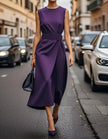 FJØRNA women's midi dress with round neck, sleeveless design, and pleated fabric, elegant and suitable for casual or formal wear.
