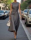FJØRNA women's midi dress with round neck, sleeveless design, and pleated fabric, perfect for casual or semi-formal wear.