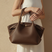 FJØRNA large women's travel tote bag with sturdy handles and spacious interior, perfect for everyday use and travel.