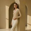 FJØRNA men's slim fit knit top with long sleeves, featuring a cozy, textured design in a neutral color.