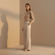 FJØRNA women's relaxed fit straight leg trousers in neutral fabric, shown laid flat with waistband and full length.