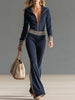 Dark blue knitted hooded zip-up V-neck jumpsuit by FJØRNA, featuring a cozy knit fabric and casual stylish design.