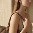 FJØRNA leather tote bag for women, large foldable bag with spacious interior and sleek design, made of durable leather.