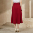 FJØRNA high waist midi skirt for women with side pockets, stylish and versatile women's pants in a neutral color.