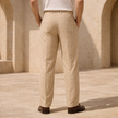 Men's linen straight leg trousers by FJØRNA with relaxed fit and striped pattern, shown in a natural pose.