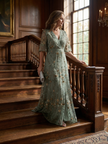 FJØRNA women's elegant floral maxi dress with halter neck, flowing fabric and vibrant pattern, perfect for summer or special occasions.