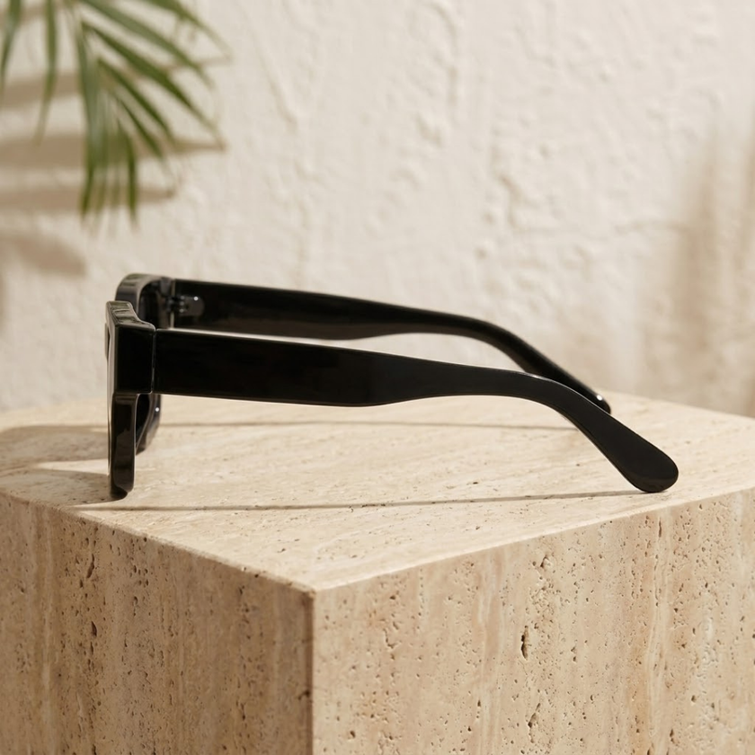 FJØRNA unisex vintage rectangular sunglasses with dark tinted lenses and black frames, accessory for women and men.