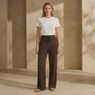 FJØRNA women's knit lounge trousers with cable-knit pattern, featuring a relaxed fit and cozy knit fabric.
