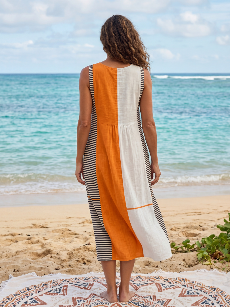 FJØRNA women's summer midi dress with sleeveless design and navy and white striped pattern, perfect for warm weather.