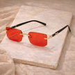 Unisex retro sunglasses by FJØRNA with round dark lenses and thick black frames, stylish accessories for men and women.