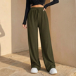 FJØRNA women's wide leg trousers with elastic waist and pleated design, featuring a relaxed fit and flowing fabric.