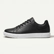 Men's leather lace-up low top sneakers by FJØRNA featuring black leather uppers and white rubber soles.