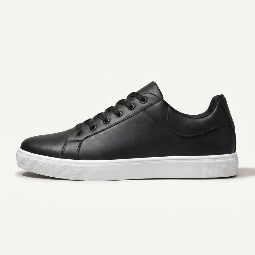 Men's leather lace-up low top sneakers by FJØRNA featuring black leather uppers and white rubber soles.