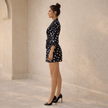 FJØRNA women’s polka dot jumpsuit with V-neck and puff sleeves, stylish and comfortable playsuit for casual or dressy occasions.